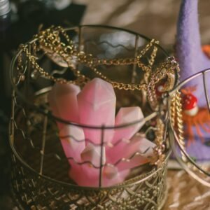 a gold and purple heart shaped object